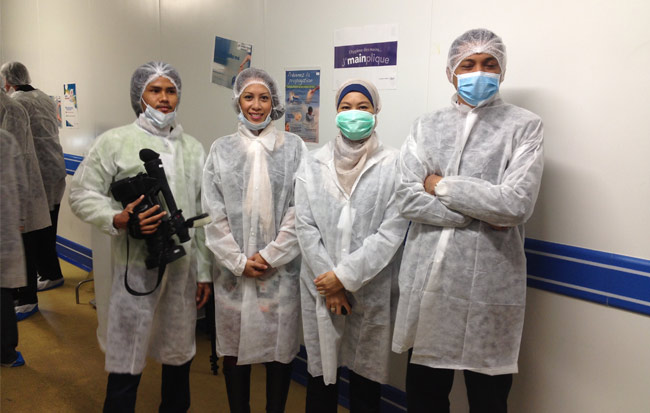 Looking fashionable with Malaysia Airlines representatives and crew in the Servair kitchen, Paris.