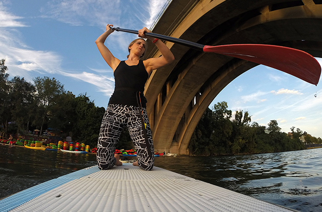 Rachel Dobroth, photographed with a GoPro, paddles out to take part in a standup paddleboard yoga class from the Key Bridge Boathouse on the Potomac River on Sept. 15 in Washington (Washington Post photo by Matt McClain)