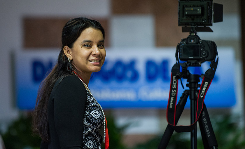 A FARC delegation next to her camera at Convention Palace in Havana during peace talks with the Colombian government, on Dec 10, 2015. From combat boots to high heels, the FARC rebels deemed that being in front of a camera could be even more intimidating that surviving the jungles. - AFP Photo/Yamil Lage