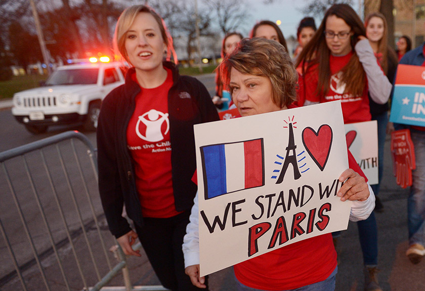 People stand in solidarity for the victims of the Paris attacks.