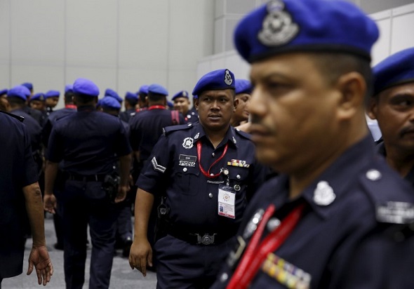 Malaysian police leave a security briefing at the 27th Association of Southeast Asian Nations (ASEAN) summit in Kuala Lumpur, Malaysia, November 18