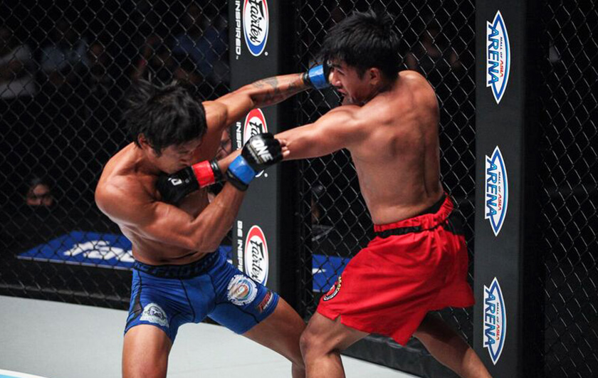 INTENSE: Both fighters Gianni Subba (left) and Geje Eustaquio (right) exchanging strikes during the bantamweight bout at ONE: Global Rivals. - ONE photo