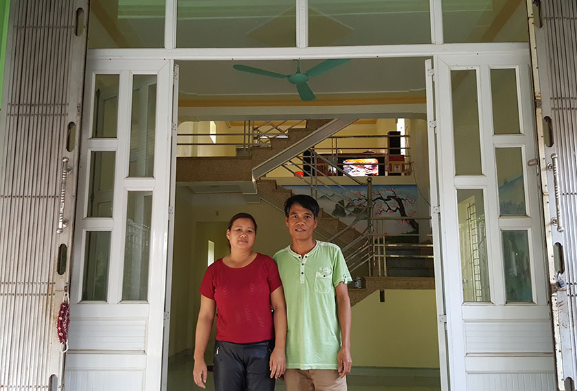 Mr An and wife in front of their home. - Photo by Karim Raslan