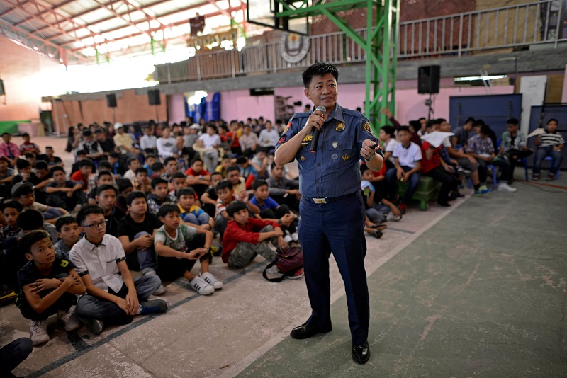 Police officer Ronaldo David, 49, speaks during a drug awareness seminar for school children in Pasay city, Metro Manila, Philippines October 1, 2016. 