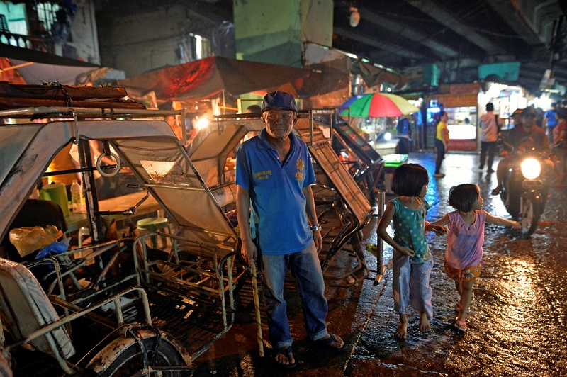 Marianito Navarra, 54, village watchman patrols a street in Pasay city, Metro Manila, Philippines November 2, 2016. 