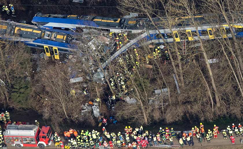 Firefighters and emergency doctors work at the site of a train accident near Bad Aibling, southern Germany. - AFP pic 