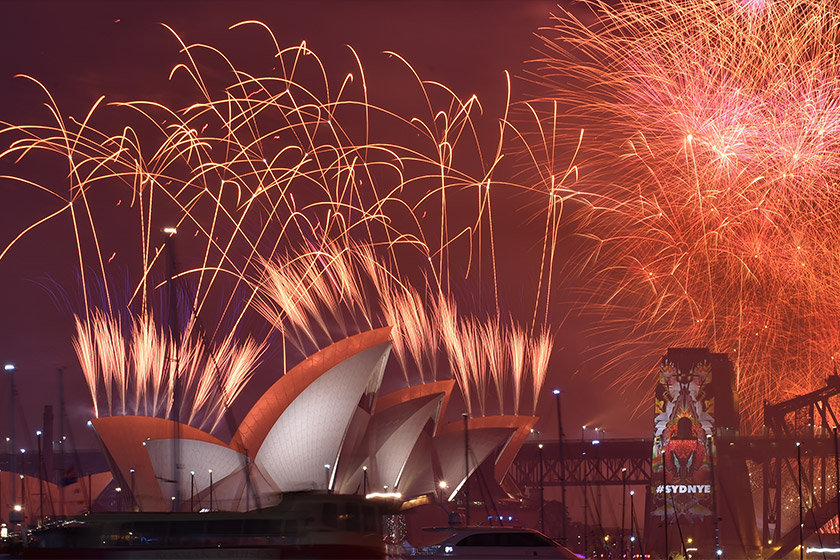 New Year's Eve fireworks erupt over Sydney's iconic Harbour Bridge and Opera House during the traditional fireworks show on Jan 1, 2016. - AFP Photo/Peter Parks