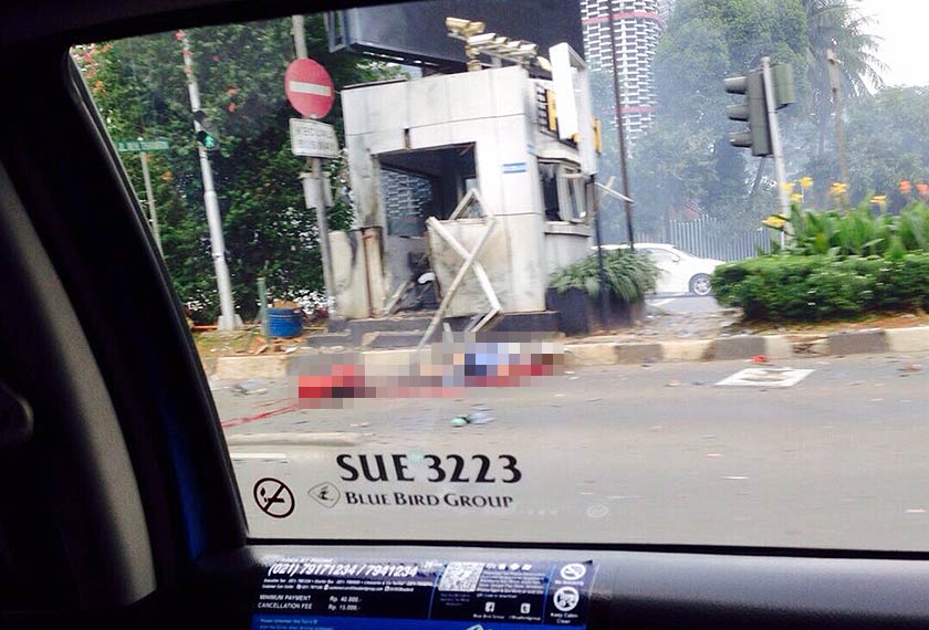 A police post on a main street was damaged after six blasts were heard.