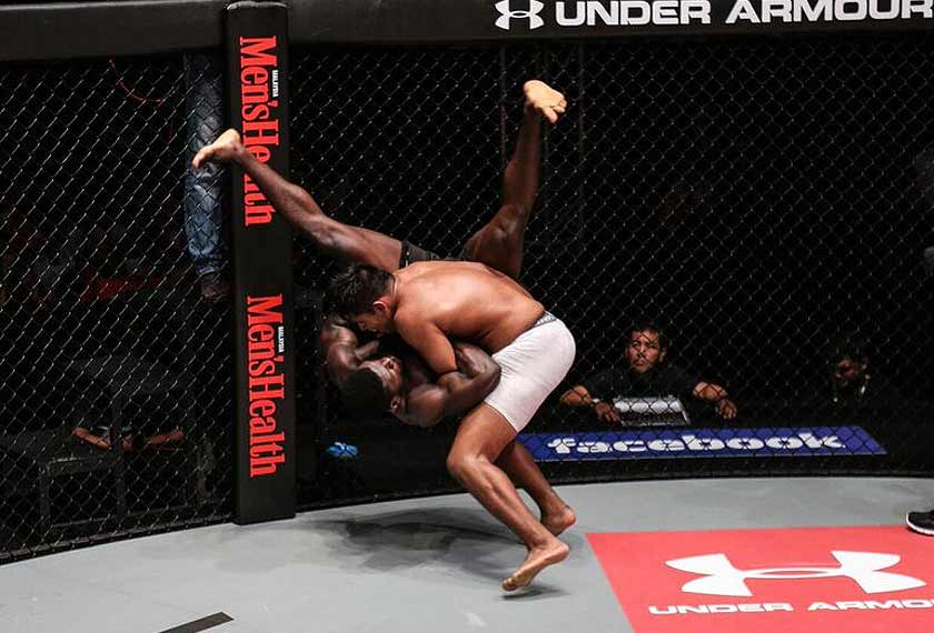 Malaysian, Agilan 'The Alligator' Thani (R) slamming Canadian James Kouame at ONE: Clash Of Heroes, Stadium Negara, Friday night. - ONE photo