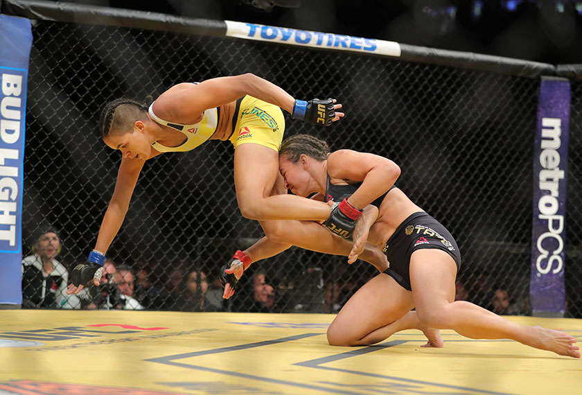Miesha Tate looks to take down Amanda Nunes during the UFC 200 event at T-Mobile Arena on July 9, 2016 in Las Vegas, Nevada. - Rey Del Rio/Getty Images/AFP 