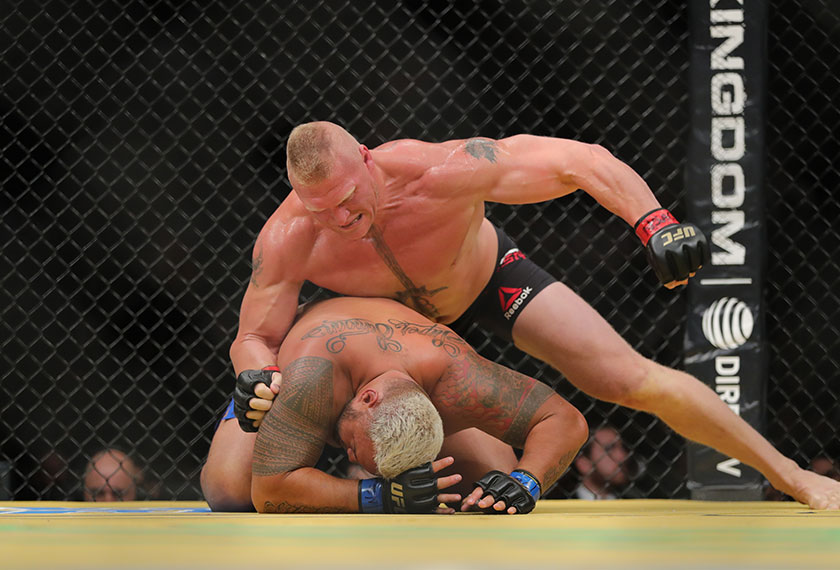 Lesnar punches Hunt (right) during the UFC 200 event at T-Mobile Arena on July 9, 2016 in Las Vegas, Nevada. - Rey Del Rio/Getty Images/AFP