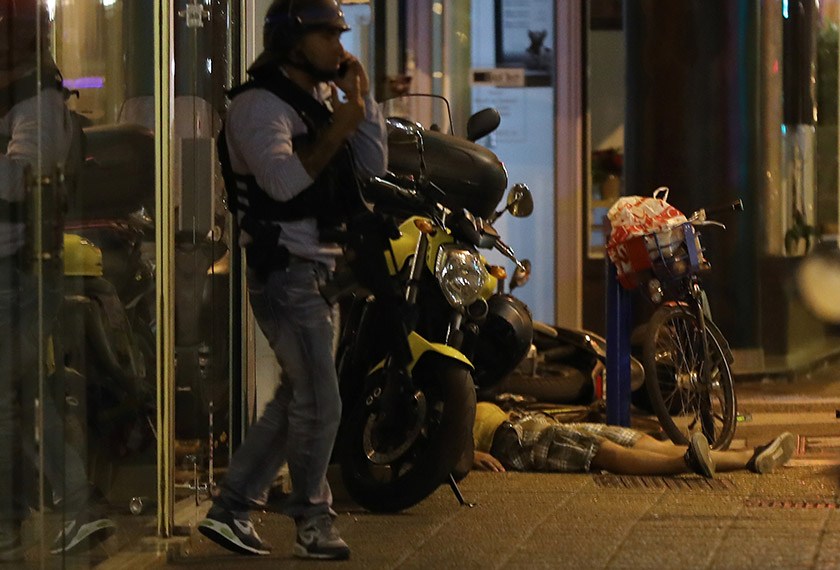 A picture taken on July 15, 2016 shows the dead body of a person on the ground after a truck drove into a crowd watching a fireworks display in the French Riviera town of Nice. - AFP Photo