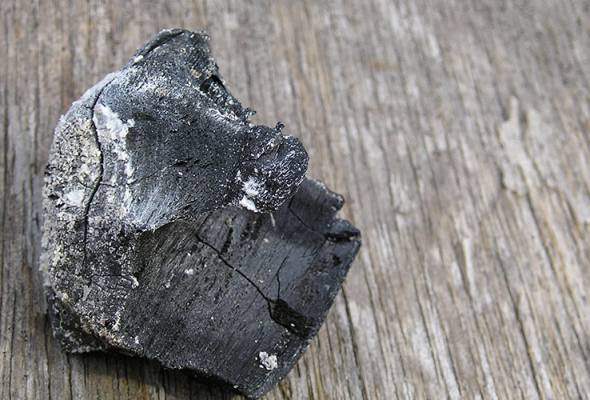 A teacher in Ipoh killed himself by inhaling burnt charcoal fumes. -Filepix