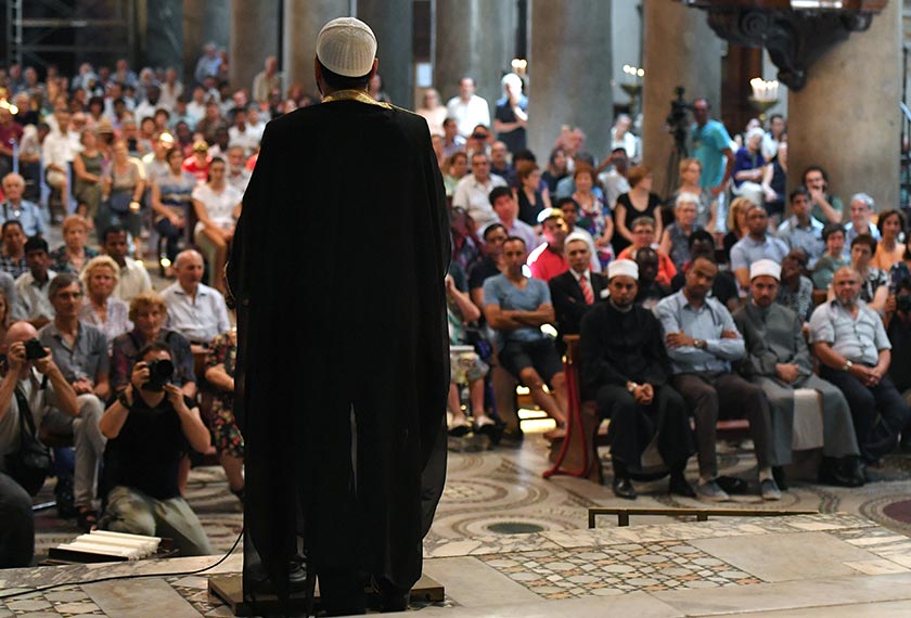 Imam Sami Salem delivers a speech during a mass in the church Santa Maria in trastevere in Rome on July 31, 2016. Muslims participate in Catholic ceremonies in churches of Italy, as in France, in solidarity after the jihadist murder of French priest priest Jacques Hamel, the latest in a string of attacks. - AFP Photo