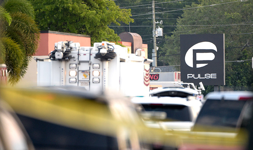 Police cars and emergency vehicles surround the Pulse nightclub, the scene of a multiple shooting, in Orlando, Fla., Sunday, June 12, 2016. - Photo AP