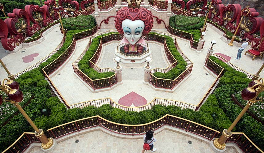 A girl walks in 'Alice in Wonderland Maze' at Shanghai Disney Resort in Shanghai on June 15, 2016. - AFP Photo