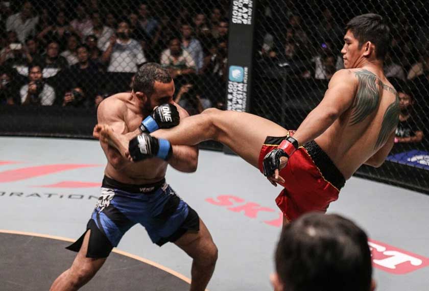 Egypt's Mohamed Ali (L) blocks a kick from 