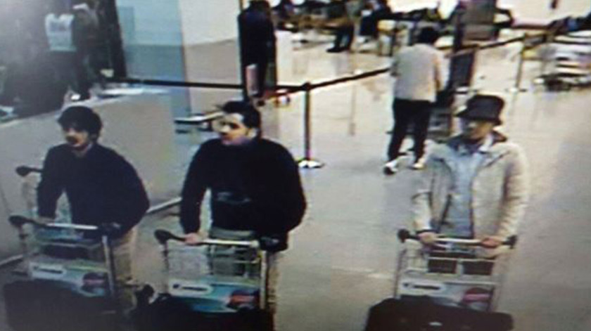 A picture released on March 22, 2016 by the belgian federal police on demand of the Federal prosecutor shows a screengrab of the airport CCTV camera showing suspects of this morning's attacks at Brussels Airport, in Zaventem. -AFP