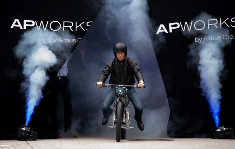 Tom Enders, CEO of Airbus, presents a Light Rider motorcycle