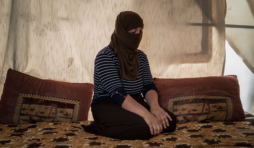 A Yazidi who had been held by Islamic State militants as a slave for several months sits in a tent outside Duhok, Iraq. Two different Islamic State captives recently appeared to be offered for sale on Facebook