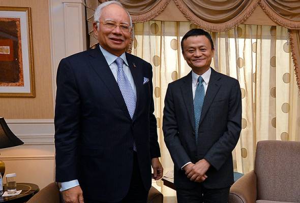 The appointment of Alibaba founder Jack Ma (right) as digital economy advisor to the Malaysian government can help spearhead the country's e-commerce development. -Filepix
