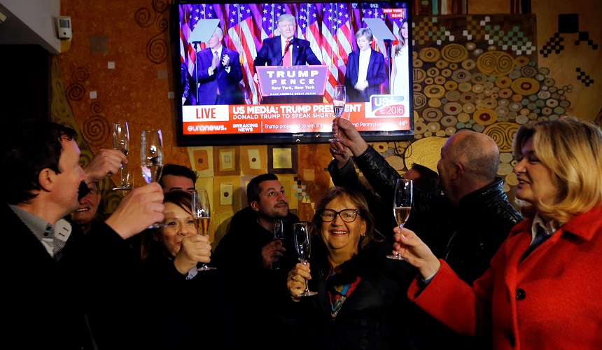 Residents celebrate during the election in Melania Trump's hometown of Sevnica, Slovenia. REUTERS/Srdjan Zivulovic
