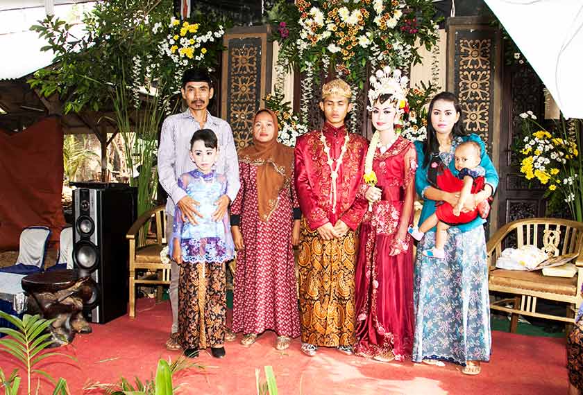 Pak Tukin with his family members at the wedding reception of his daughter. - Karim Raslan Photo