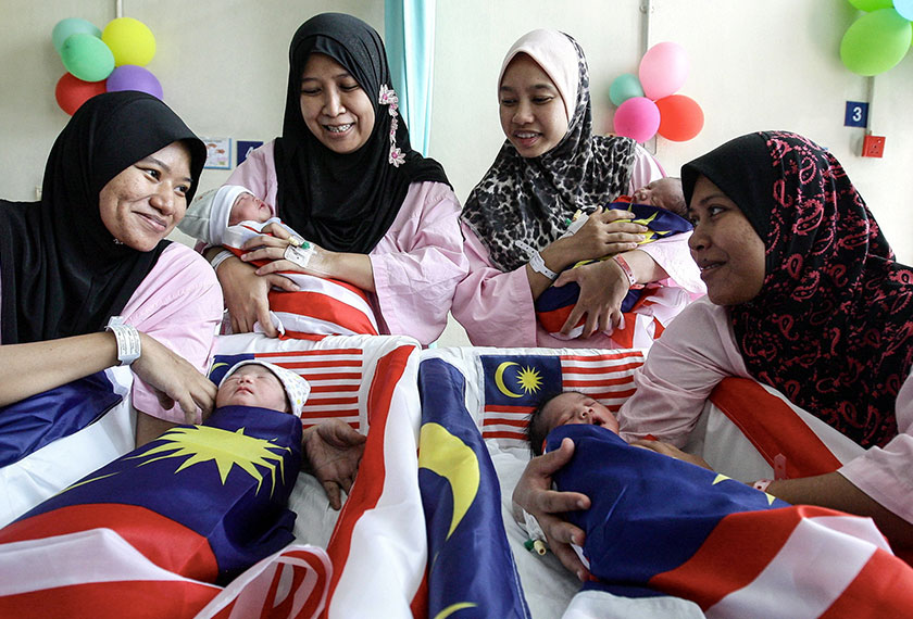 (From left) Shelei Hermansyah, 27, Noranis Haslinda Md Yunus, 30, Nur Fatin Kamarudin, 26, and Nor Ambridah Sulaiman, 29, with their new bundle of joy at the HKL today. - BERNAMApic