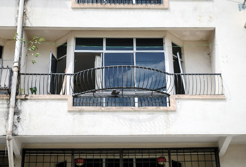 The unit at the Nova Apartments where the man and two of his children were found dead earlier today. - BERNAMApic