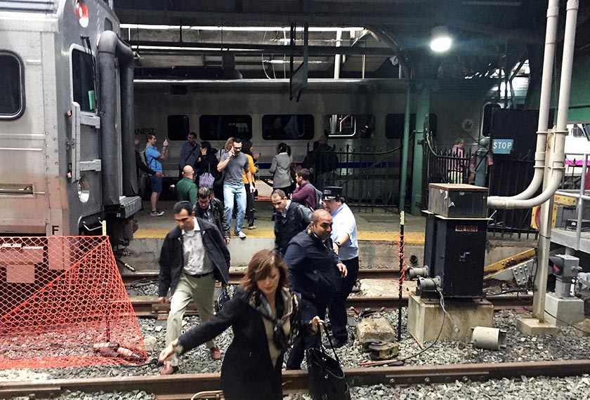 Passengers rush to safety after a NJ Transit train crashed in to the platform at the Hoboken Terminal Sept 29, 2016 in Hoboken, New Jersey. - AFP
