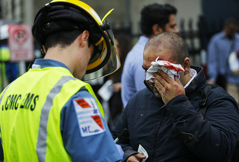 People are treated for their injuries outside after a NJ Transit train crashed in to the platform at Hoboken Terminal Sept 29, 2016 in Hoboken, New Jersey. - AFP