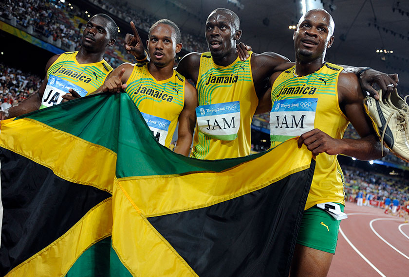 Men's 4x100m relay Asafa Powell, Usain Bolt, Michael Frater, Nesta Carter of Jamaica celebrate after winning the final of the athletics competition during the Beijing 2008 Olympic Games.