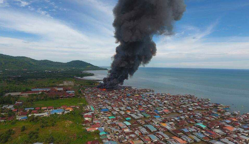 More than 1,000 residents in Kampung Hidayat, 4th Mile Jalan Apas were left homeless when about 250 houses went up in smoke on July 1. - Photo courtesy of Fire & Rescue Dept