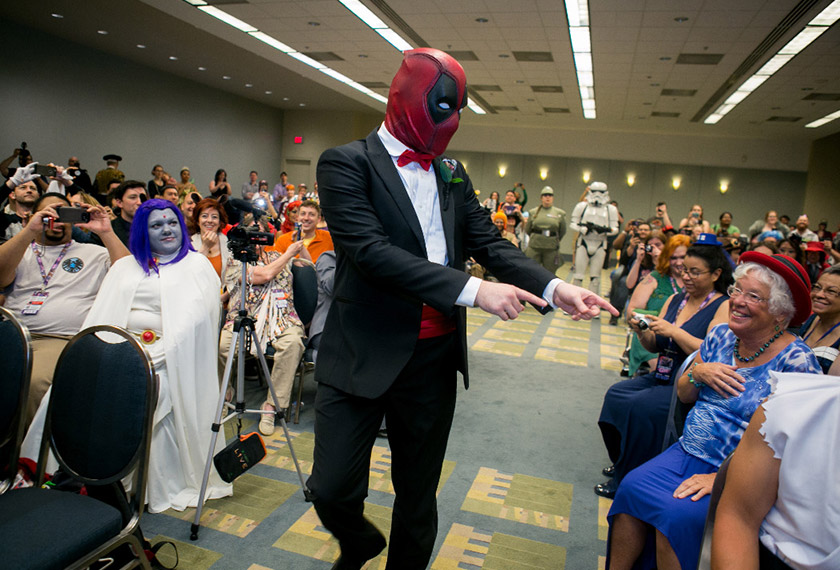 Groom Adam Merica, dressed as Deadpool, makes his way down the aisle to marry his bride at AwesomeCon in Washington, DC on June 17, 2017. Photo by Linda Wang for The Washington Post.