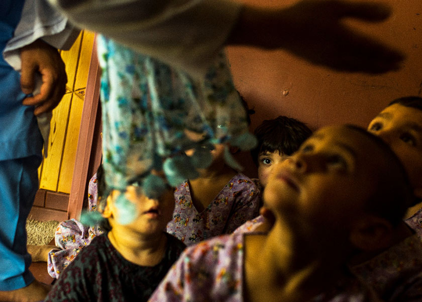 Children of drug-addicted women with a nurse after a class at the rehab center. They are separated from their mothers for study and play. (Andrew Quilty/For The Washington Post)