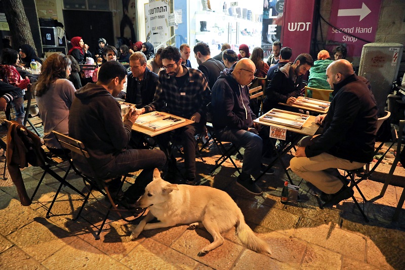 Arab and Jewish players compete in a backgammon championship organised by Double Yerushalmi, a group trying to build closer ties between Arabs and Jews through cultural activities, in Jerusalem February 27, 2017. REUTERS/Ammar Awad