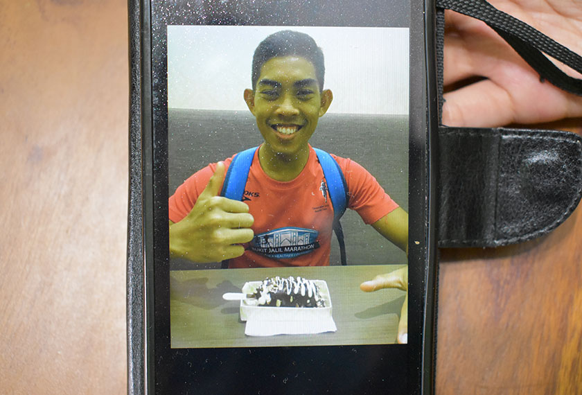 Hawa has a portrait of her late son as the screensaver on her mobile phone. Karim Raslan Photo