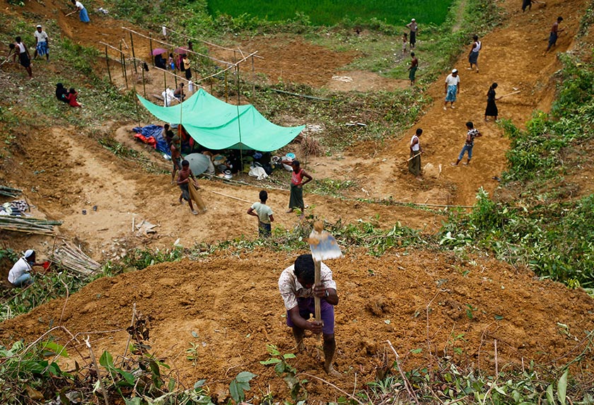 Rohingya refugees cut hill to make their makeshift shelter near Balukhali in Cox’s Bazar, Bangladesh on Sept 4, 2017. - REUTERS