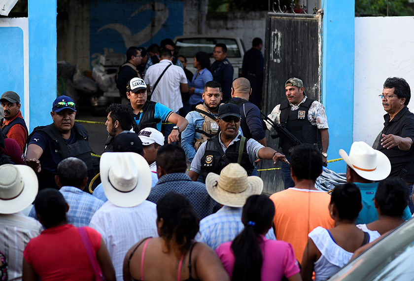 Policemen guard a crime scene where mayoral candidate Santana Cruz Bahena was gunned down at his home in the municipality of Hidalgotitlan, in the state of Veracruz, Mexico on Nov 20, 2017. - REUTERS