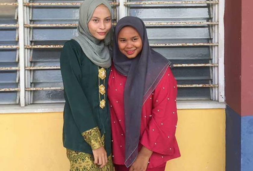 Nur Wardiah (kanan), 14 tahun, merupakan seorang pelajar Sekolah Menengah Penambang. - Astro AWANI