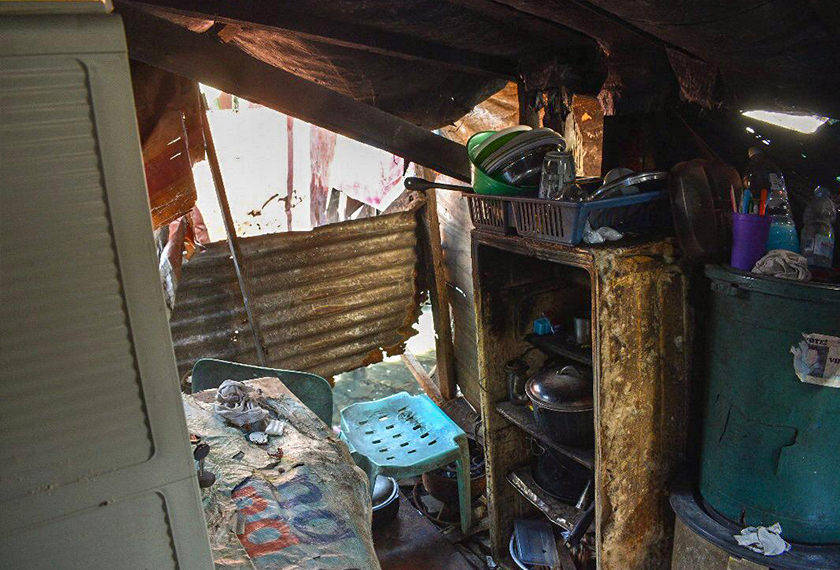 Richelle’s kitchen area in her makeshift hut: one of two spaces that accomodates a total of eight people. Hezril Azmin/Ceritalah