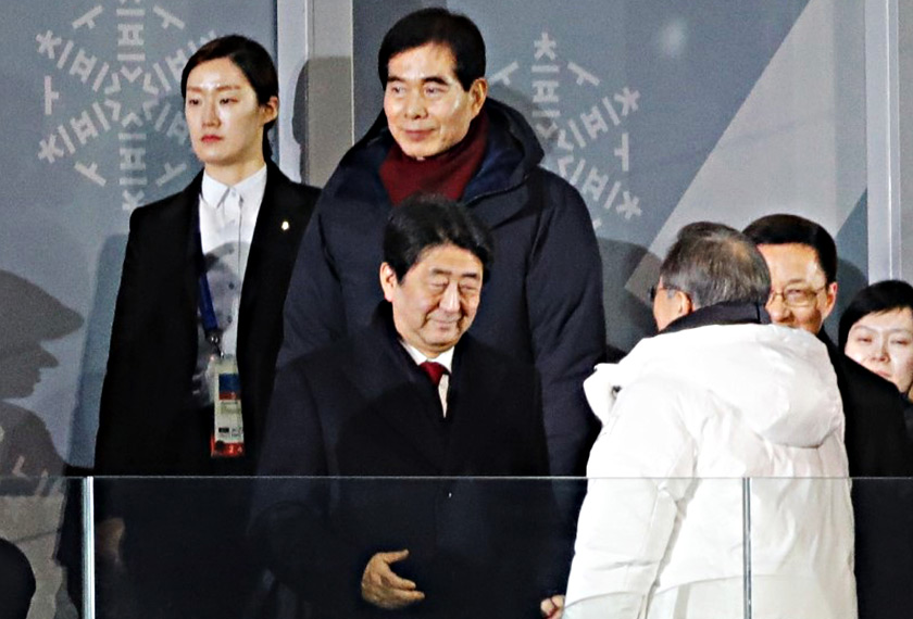 President of South Korea Moon Jae-in and Japan's Prime Minister Shinzo Abe during the opening ceremony. - REUTERS/Kim Kyung-Hoon