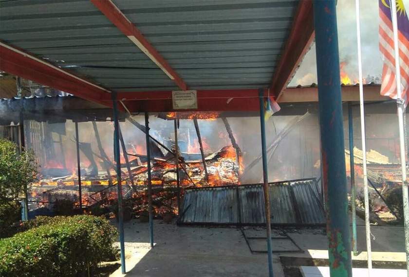 Bangunan kayu SK Sentosa musnah 100 peratus akibat kebakaran. - Foto ihsan JBPM Sabah