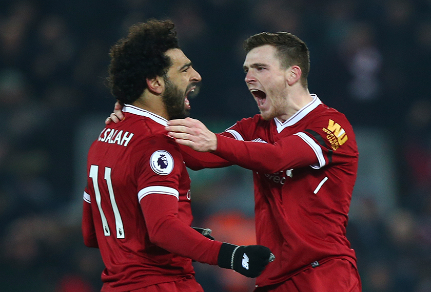 Andrew Robertson (kanan) meraikan kejayaan Mohamed Salah menjaringkan gol keempat Liverpool menentang Manchester City semalam.