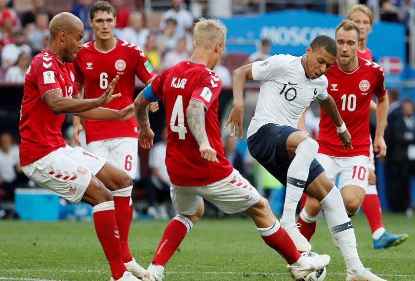France's Kylian Mbappe in action with Denmark's Simon Kjaer and Mathias Jorgensen at Luzhniki Stadium, Moscow, Russia - June 26, 2018. REUTERS