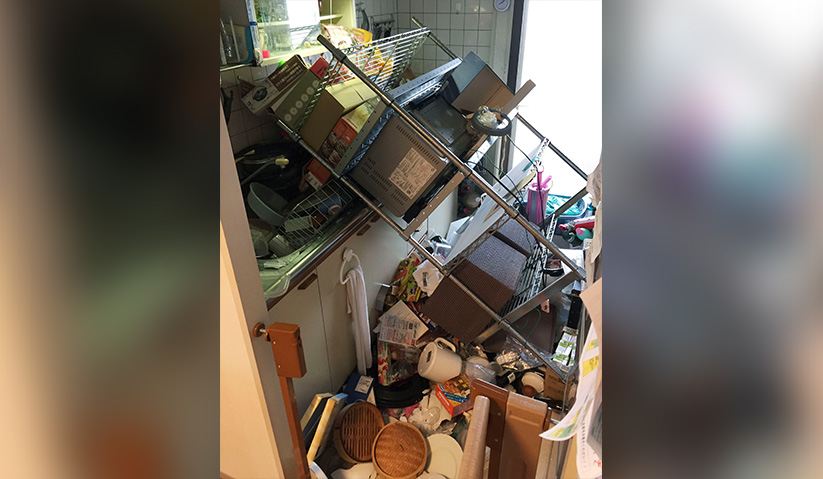 Scattered objects lie in the kitchen of a damaged house in Osaka, following an earthquake on Monday. - Kyodo News via AP