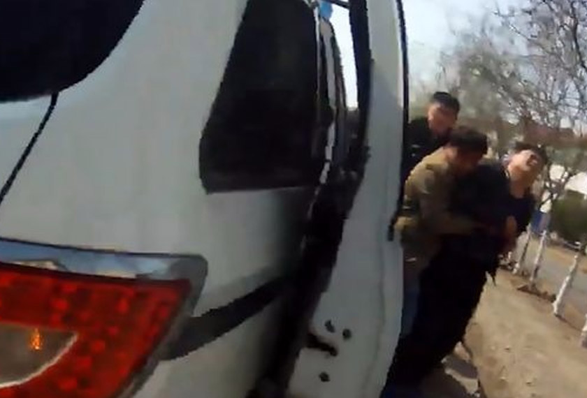 Imej dari rakaman video yang menunjukkan Zhang dibawa ke lokasi kejadian dalam keadaan menangis teresak-esak. - AsiaWire