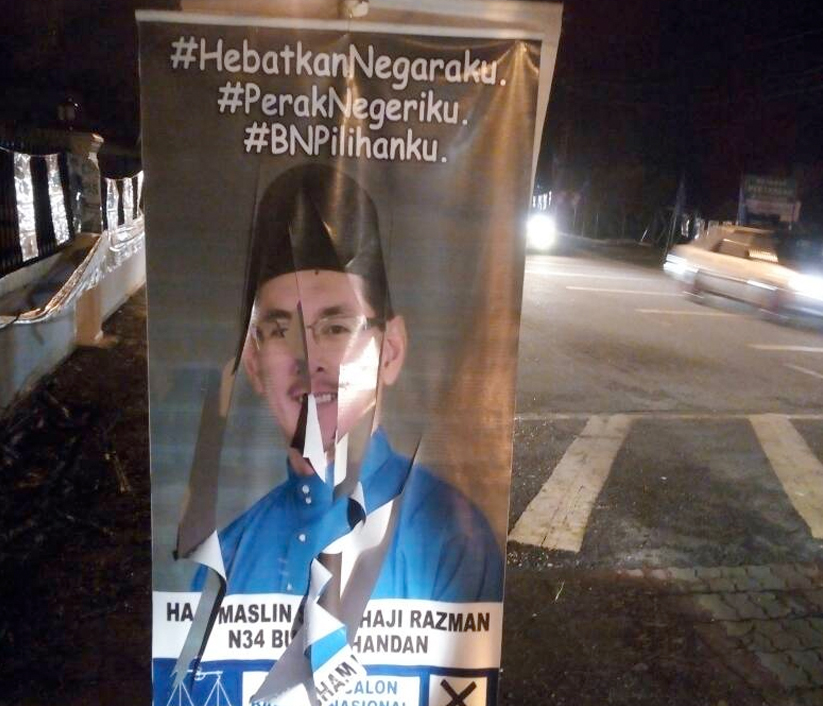 Poster Maslin Sham yang digantung di sekitar Kuala Kangsar dilihat dirosakkan oleh individu tidak bertanggungjawab.