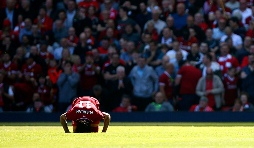 Liverpool's Mohamed Salah celebrates scoring his side's first goal of the game during their English Premier League soccer match against Brighton & Hove Albion at Anfield, Liverpool, England, Sunday, May 13, 2018. - AP