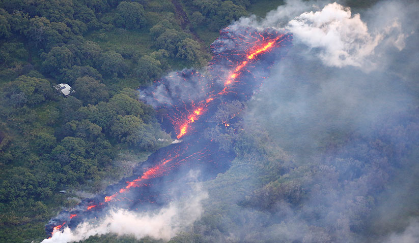 Lava erupts from a fissure east of the Leilani Estates subdivision during ongoing eruptions of the Kilauea Volcano in Hawaii, U.S., May 13, 2018. - REUTERS